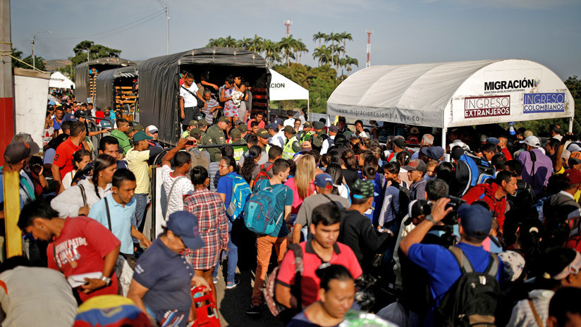 Migrantes venezolanos siendo trasladados en camión tras el desalojo de un centro para personas sin techo en Cucuta (Colombia). 24 de enero de 2018. 