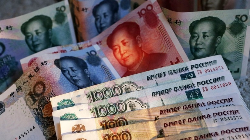 Rusia y China acuerdan desarrollar el comercio bilateral en monedas nacionales 