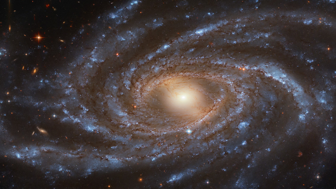 A beautiful Hubble statue shows a beautiful large galaxy filled with young blue stars