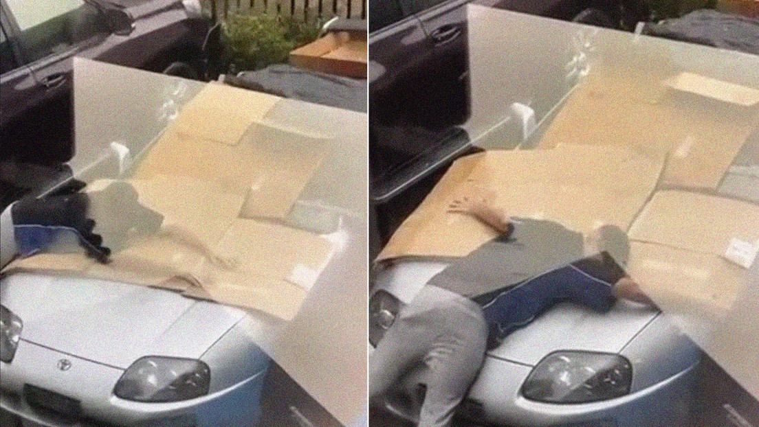 Un joven protege su coche deportivo de una granizada cubriéndolo con su propio cuerpo (VIDEO)