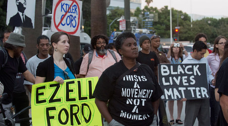 Protestors carry signs during a demonstration by "Black Lives Matter" in Los Angeles, California August 11, 2015 © Phil McCarten