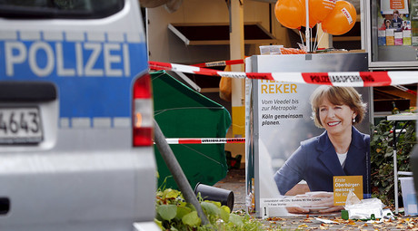 First aid equipment lies on the ground next to an election campaign poster of Henriette Reker in Cologne, Germany October 17, 2015. © Wolfgang Rattay