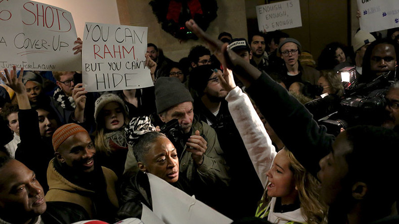 Anti-violence protesters march through streets of Chicago on New Year Eve