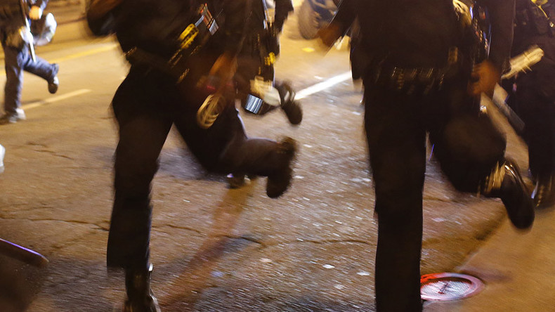 Police officers flee angry mob in Swedish refugee center through back door