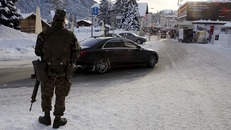 A Swiss army soldier patrols downtown Davos ahead of the Annual Meeting 2016 of the World Economic Forum (WEF) in Davos, Switzerland January 18, 2016. © Ruben Sprich