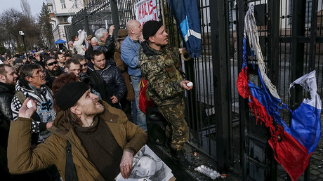 Protesters throw eggs towards a building of the Russian embassy during a rally demanding the liberation of Ukrainian army pilot Nadezhda Savchenko by Russia, in Kiev, Ukraine, March 6, 2016. © Gleb Garanich