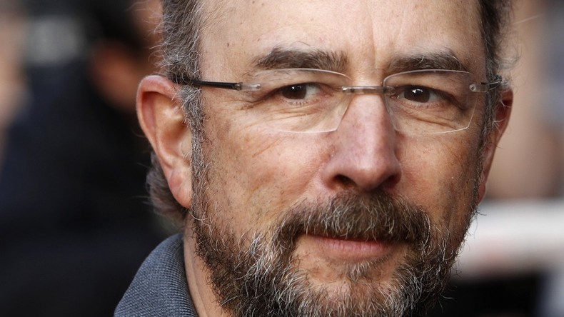 Even when he's not on the screen, there's a Trump banner below - Richard Schiff