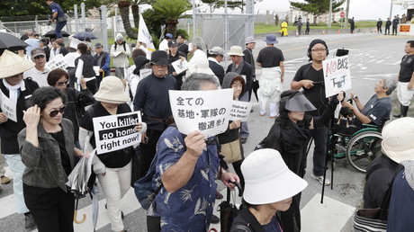 Okinawa residents stage a protest against a murder of the 20-year-old Rina Shimabukuro, in front of the gate of Camp Foster in Kitanakagusu, Okinawa prefecture on May 22, 2016. © Jiji Press