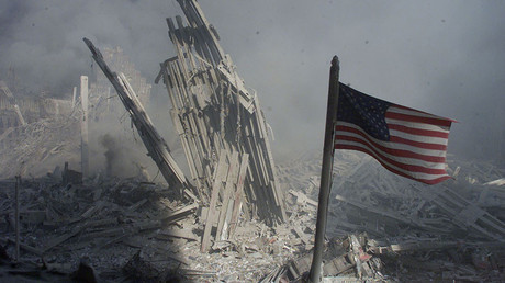 An American flag flies near the base of the destroyed World Trade
Center in New York, in this file photo from September 11, 2001, taken
after the collapse of the towers. © Peter Morgan
