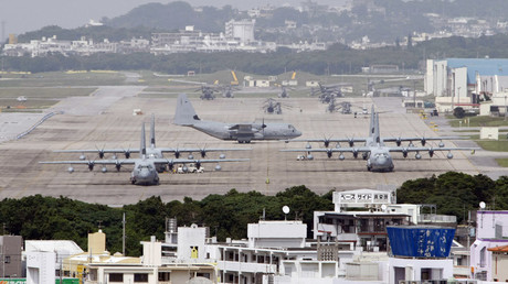 Hercules aircraft are parked on the tarmac at Marine Corps Air Station Futenma in Ginowan on Okinawa © Issei Kato