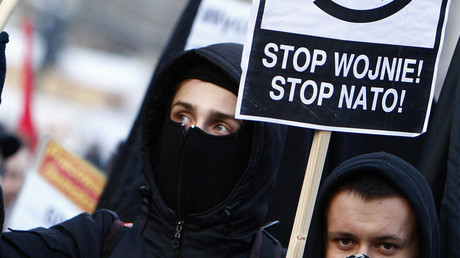 ‘No to militarism!’ Anti-war activists mirror NATO meeting in Warsaw with own summit  