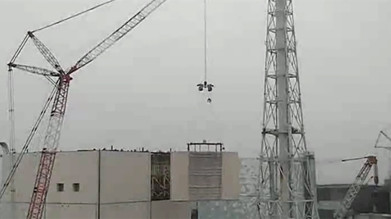 TEPCO dismantles safety wall around crippled Fukushima reactor building (VIDEO)