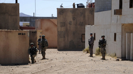 Afghan Uniform Police and soldiers from the U.S. Army 4th Brigade Combat Team provide 360-degree security outside a compound during training at National Training Center at Ft. Irwin, California, U.S. on September 18, 2011. © Austin Pritchard / U.S. Army