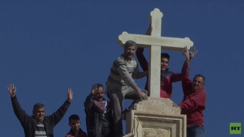 Kurdish militias & locals replace cross destroyed by ISIS atop Christian church near Mosul (VIDEO)