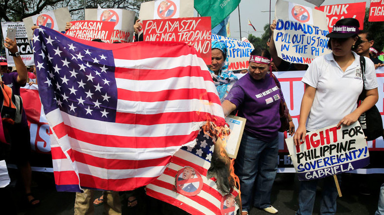 'Dump Trump’: Filipinos gather to burn US flag, throw Trump photos into rubbish bins (PHOTOS)