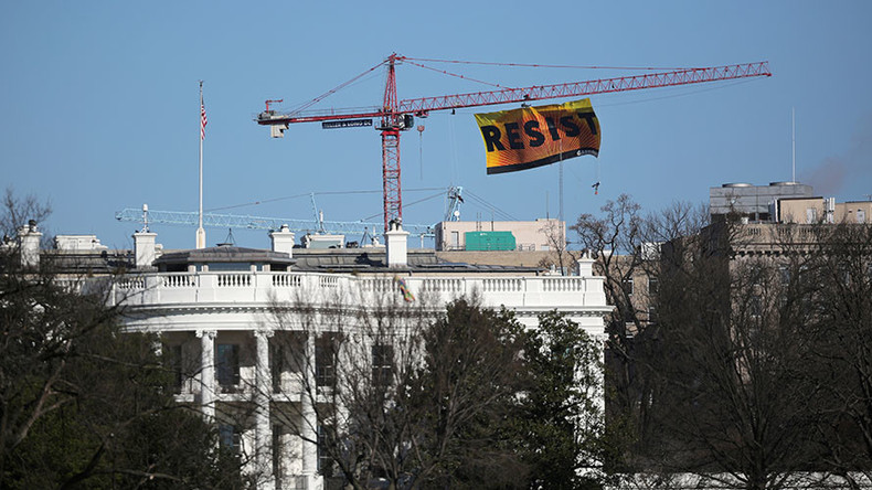 Protesters climb crane at DC construction site