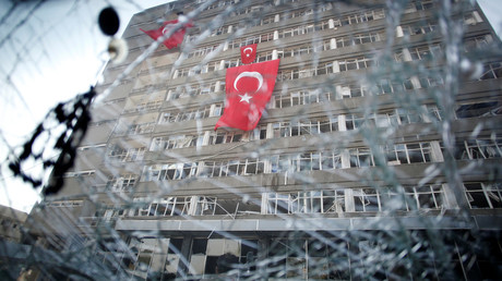 The Ankara police headquarters is seen through a car's broken window caused by fighting during a coup attempt in Ankara, Turkey, July 19, 2016. © Baz Ratner