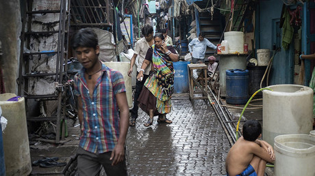 Residents walk through an alley in Dharavi, one of the largest slums in Asia, in Mumbai © Danish Siddiqui