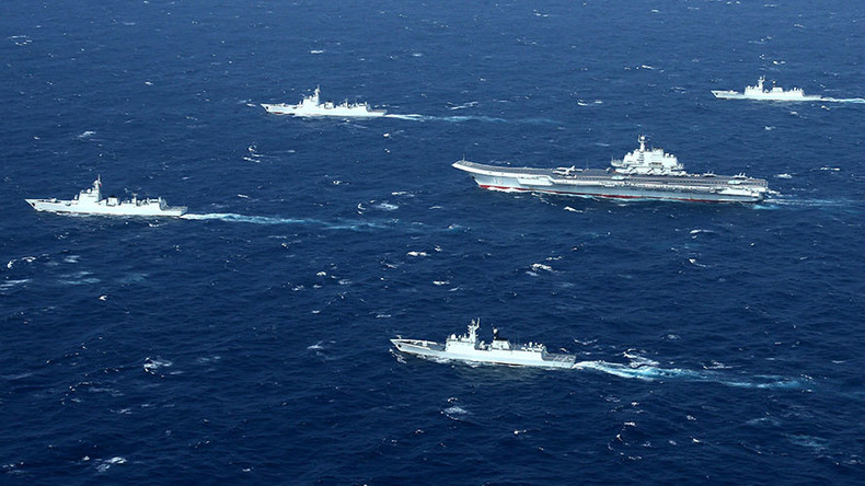 China to intercept 'intruding' aircraft, follow military vessels amid efforts to strengthen navy