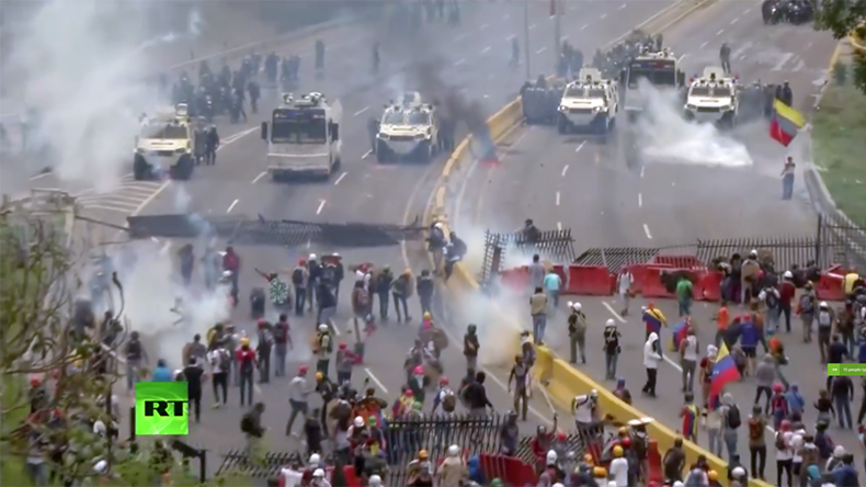 Police fire water cannon at anti-govt rally in Venezuela after pelted with smoke bombs