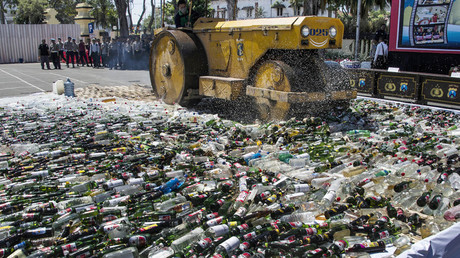 Indonesia police publicly steamroller 100k bottles of booze ahead of Ramadan (PHOTOS)