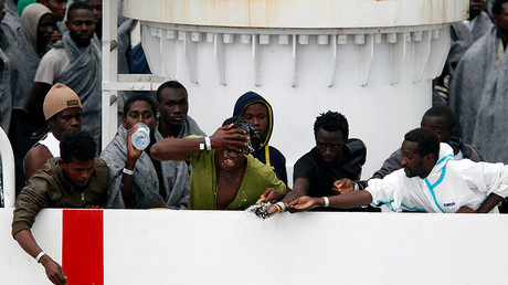 FILE PHOTO: A migrants waits to disembark from Italian Coast Guard patrol vessel Diciotti in the Sicilian harbour of Catania, Italy © Antonio Parrinello