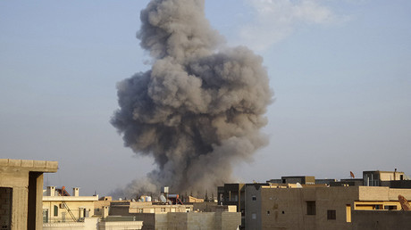 FILE PHOTO: Smoke rises after a U.S.-led air strike in Raqqa © Nour Fourat