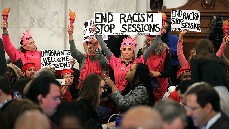Judge tosses out jury conviction of protester who laughed at Jeff Sessions