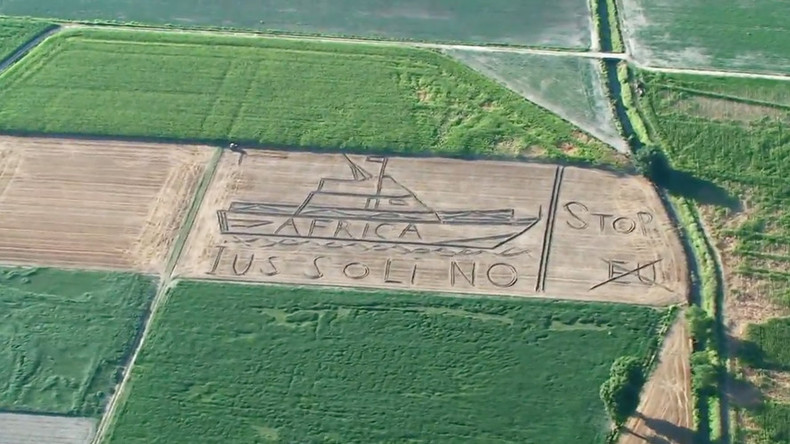 'Stop, EU': Giant anti-migrant message ploughed into Italian field (VIDEO)