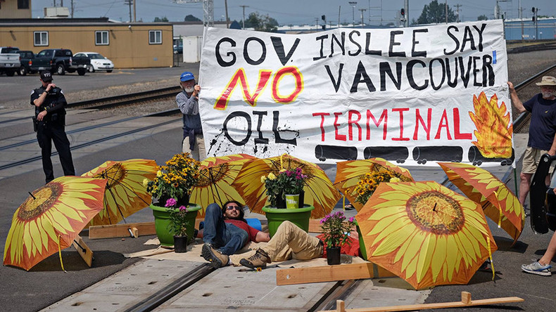 2 protesters arrested after laying down on tracks to block oil train in Washington