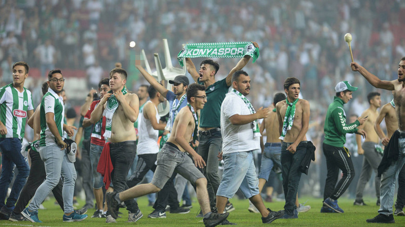 Investigation launched after hundreds of Turkish football fans brawl on pitch 