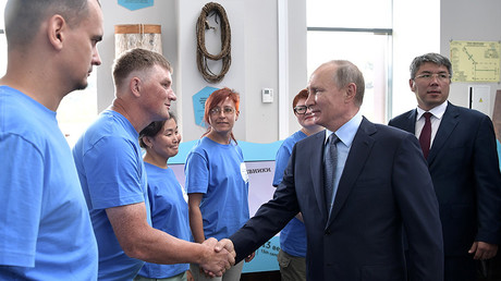 Russian President Vladimir Putin during a meeting with volunteers of the Great Baikal Trail public organisation at the Baikal Reserve visitor center  August 3, 2017.   © Aleksey Nikolskyi