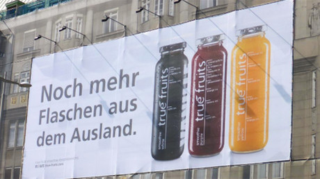‘More bottles from overseas’ slogan on a True Fruits billboard in Austria. © truefruitssmoot