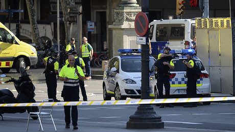 Medical staff members and policemen stand in a cordoned off area after a van ploughed into the crowd, injuring several persons on the Rambla in Barcelona on August 17, 2017. ©
Josep Lago