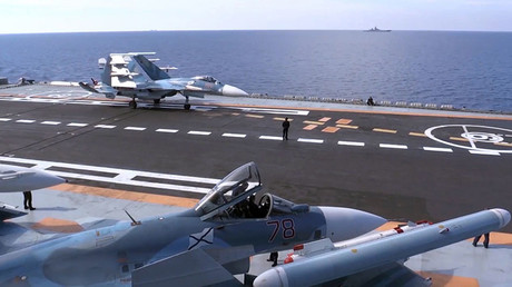 A Sukhoi Su-33 air superiority fighter of the Russian Aerospace Force before taking off from the deck of Admiral Kuznetsov heavy aircraft-carrying missile cruiser in the Mediterranean Sea near Syria. © Sputnik