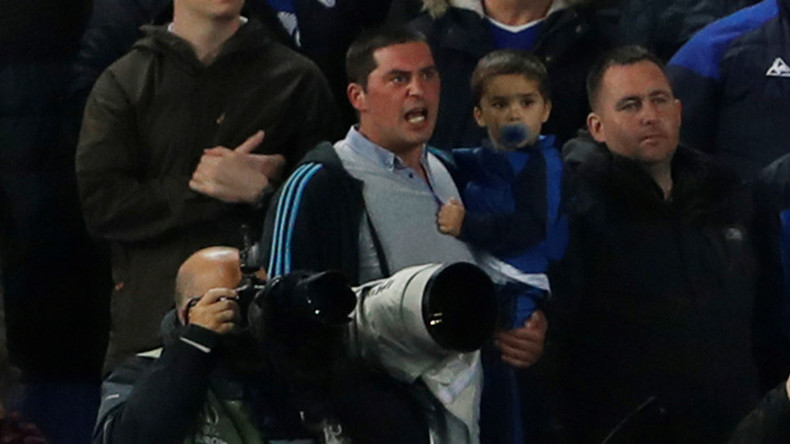 English football fan banned for life after joining player brawl while holding child (VIDEO)