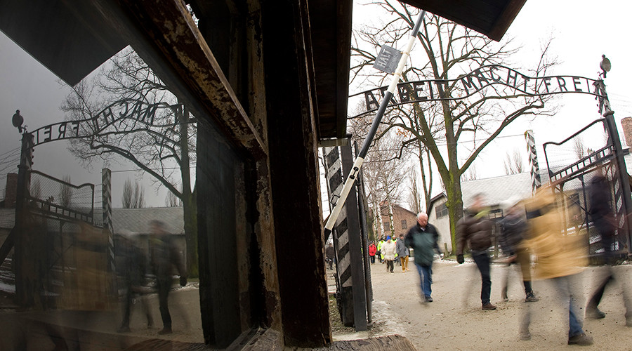 Cambridge college apologizes for Auschwitz Nazi death camp image on welcome leaflet