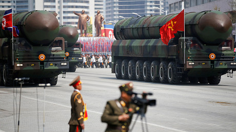 FILE PHOTO: Intercontinental ballistic missiles (ICBM) are driven past the stand with North Korean leader Kim Jong Un during a military parade in Pyongyang. © Damir Sagolj