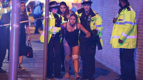FILE PHOTO: An injured concert-goer is helped by police and emergency responders at the Manchester Arena after reports of an explosion, Manchester, England © Joel Goodman / Global Look Press