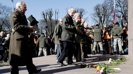 People at the annual procession commemorating the Latvian Waffen-SS (Schutzstaffel) unit in Riga, Latvia © Reuters