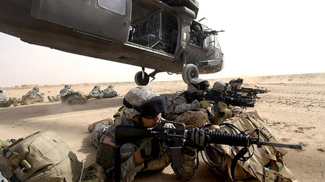 FILE PHOTO: U.S. Army soldiers from the 1st Brigade, 1st Armored Division, dismount a UH-60 Blackhawk helicopter during an air assault in the Al Jazeera Desert, Iraq © U.S. Air Force