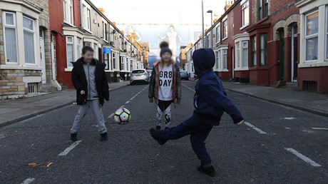 FILE PHOTO: Children play football in the streets © Reuters Staff