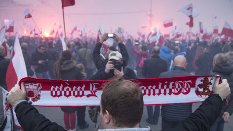 November 11, 2017 - Warsaw, Poland - Man holds a national scarf during Independence March © Maciej Luczniewski