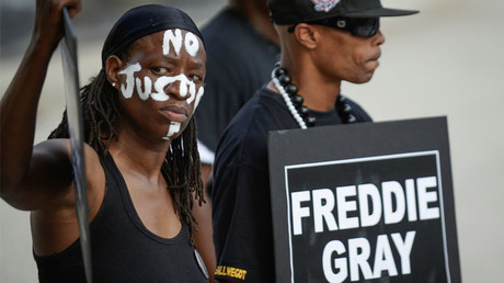 Selah and local artist PFK Boom gather to remember Freddie Gray and all victims of police violence. © Bryan Woolston