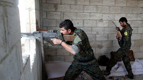 FILE PHOTO: A Kurdish fighter from the People's Protection Units (YPG). © Goran Tomasevic