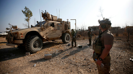 US military vehicles are seen in the town of Bashiqa, Iraq, during an operation to attack Islamic State militants in Mosul on November 7, 2016. © Azad Lashkari 