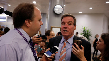 Senator Mark Warner (D-Virginia) speaks to reporters ahead of the weekly party luncheons on Capitol Hill in Washington, US, on August 1, 2017. © Aaron P. Bernstein