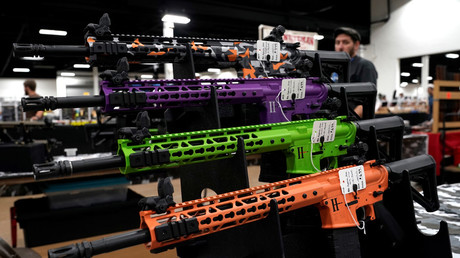 FILE PHOTO: AR-15 rifles with colored hand guards are displayed for sale at the Guntoberfest gun show in Oaks, Pennsylvania, U.S., October 6, 2017. © Joshua Roberts