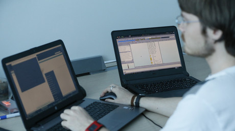 FILE PHOTO: A laptop display (R) shows part of a code, which is the component of Petya malware computer virus © Valentyn Ogirenko