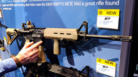 Smith & Wesson M&P15 MOE Mid rifles are displayed at the Smith & Wesson booth at the National Shooting Sports Foundation's 34th annual Shooting, Hunting, Outdoor Trade (SHOT). Ethan Miller